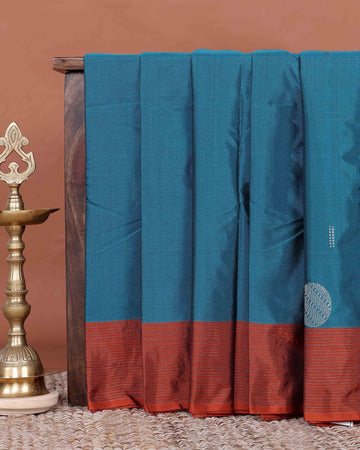 Elegant Semi Soft Silk Saree with Plain Body and Contrast Zari Woven Border - Teal Blue