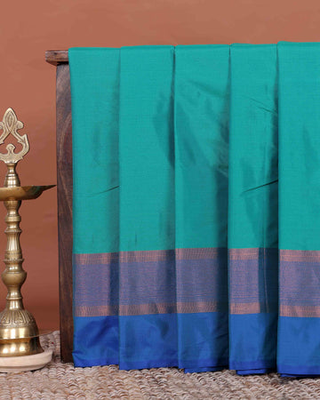 Elegant Semi Soft Silk Saree with Plain Body and Classic Zari Woven Contrast Border - Teal
