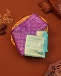 Kanchipuram Pure Silk Saree with Intricate Zari Weaves and Traditional Motifs - Purple