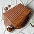 Light Peach Bengal Cotton Saree With Striped Weave Contrast Border And Woven Motifs  Folded Product View