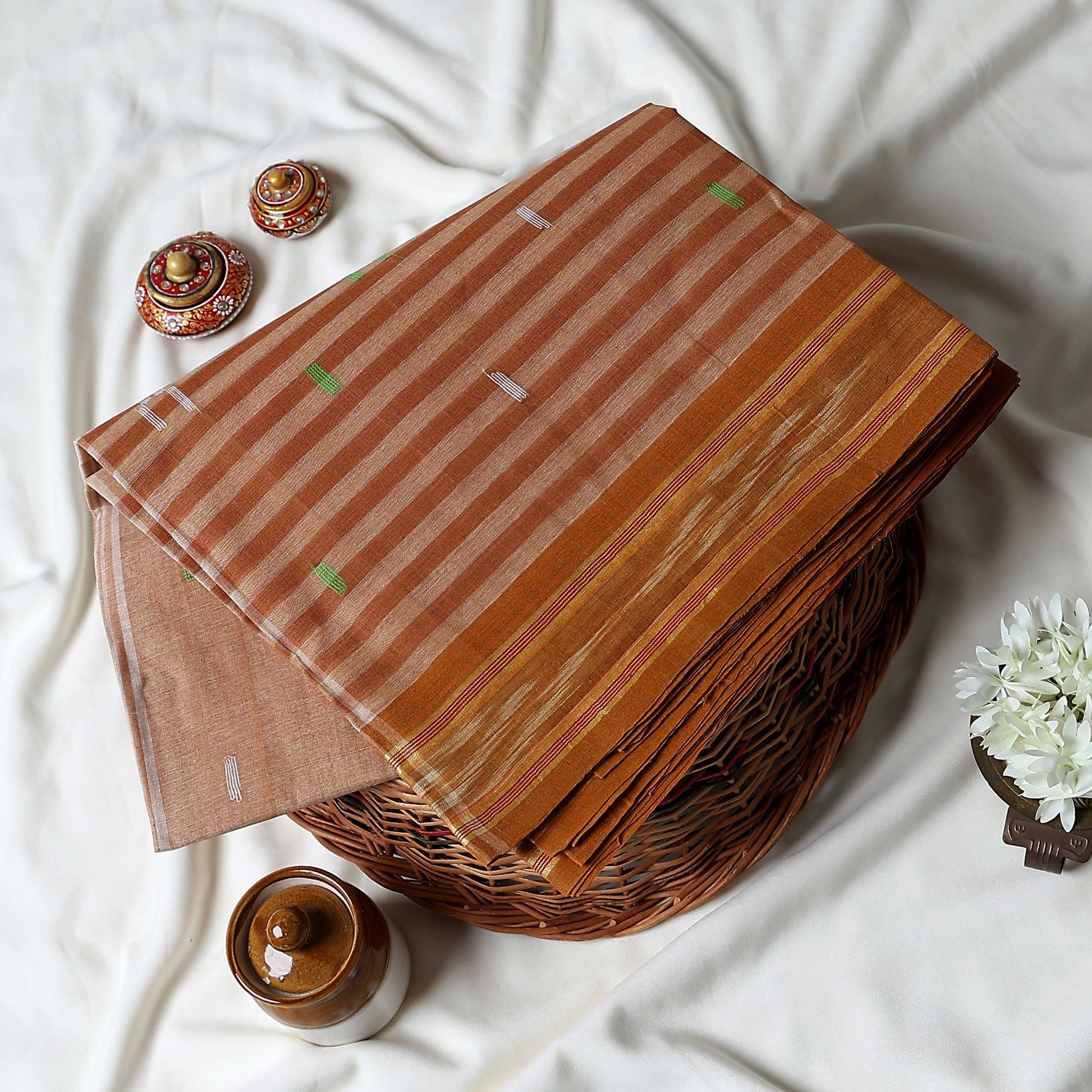 Light Peach Bengal Cotton Saree With Striped Weave Contrast Border And Woven Motifs  Folded Product View