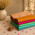 Multicolor Bengal Cotton Saree Collection With Contrast Borders And Woven Motifs Folded Stack View