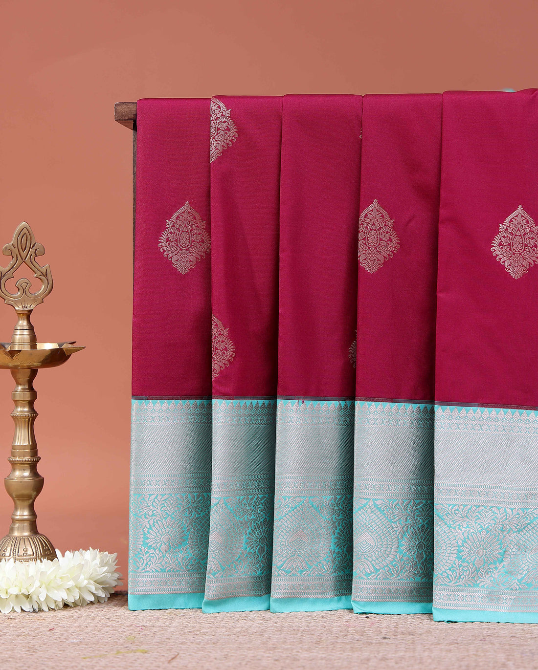 Elegant Niranjana Silk Saree Adorned with Fine Butta Motifs and Rich Zari Border - Maroon