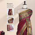 Chettinad cotton saree with striped body peacock zari woven border maroon tone front draped mannequin view.