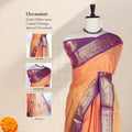Chettinad cotton saree with broad floral zari border orangeplain body with subtle buttas front draped view on mannequin.