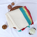 Mul mul cotton saree with cream body gold zari border teal and pink contrast stripes top view with tassels