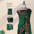 Kanchi Cotton Saree With Black And Gold Zari Border In Dark Green Front View On Mannequin With Flowing Pallu
