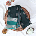 Dark Green Elampillai silk cotton saree with zari buttas, vertical stripes and silver zari border folded top view