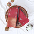 Dark Pink Elampillai silk cotton saree with silver floral zari buttas, vertical stripes and contrast zari border folded top view