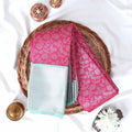 Elampillai silk cotton saree with leaf jaal woven pink body and turquoise chevron zari border top view