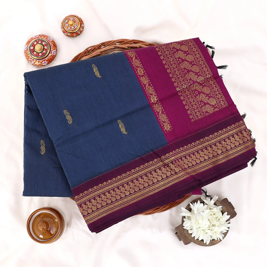Kalyani Cotton saree with plain deep blue body and maroon zari woven border, front drape view