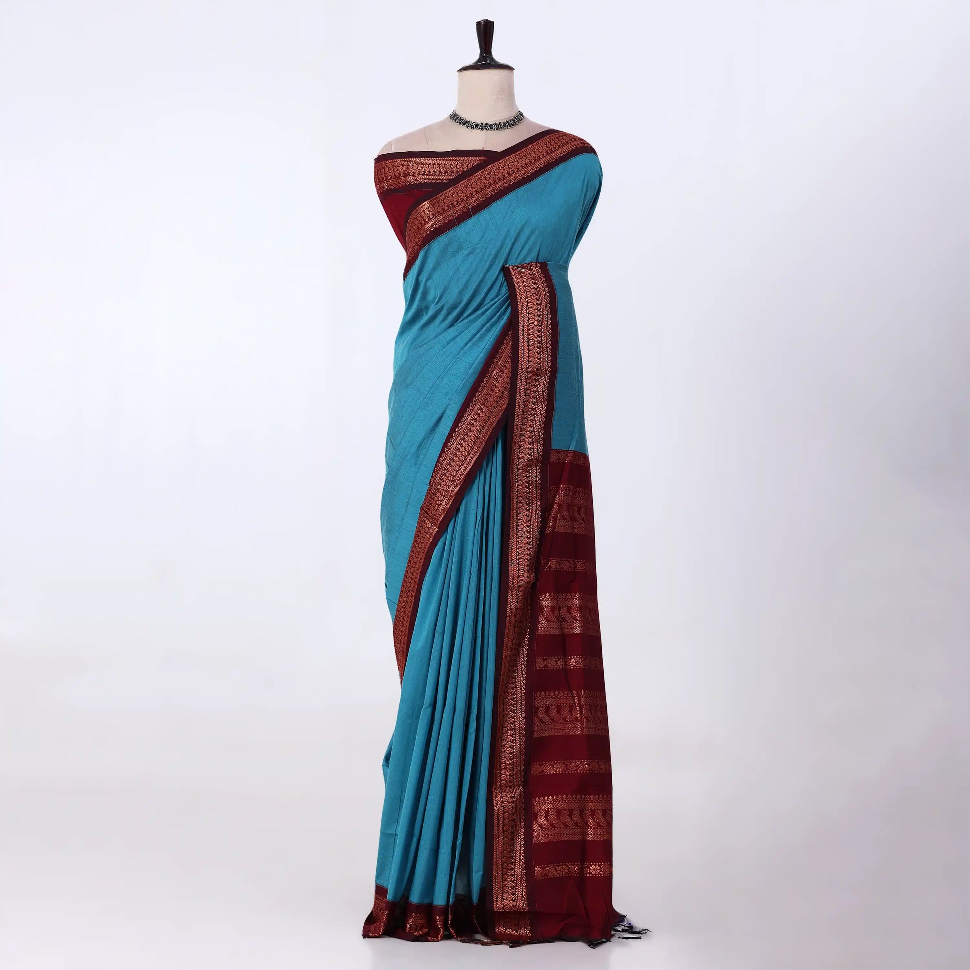 Kalyani Cotton saree with sky blue body and maroon zari woven border, front drape view