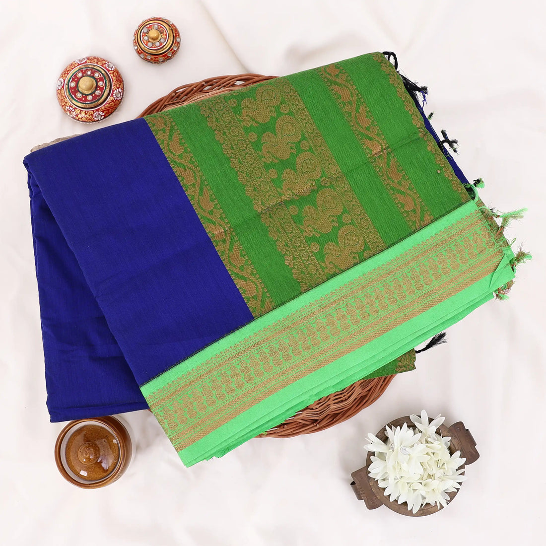 Kalyani Cotton saree with royal blue body and green zari woven border, front drape view