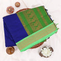 Kalyani Cotton saree with royal blue body and green zari woven border, folded top view