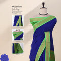 A royal blue saree with a bright green border with detail of head, blouse, and pallu. 