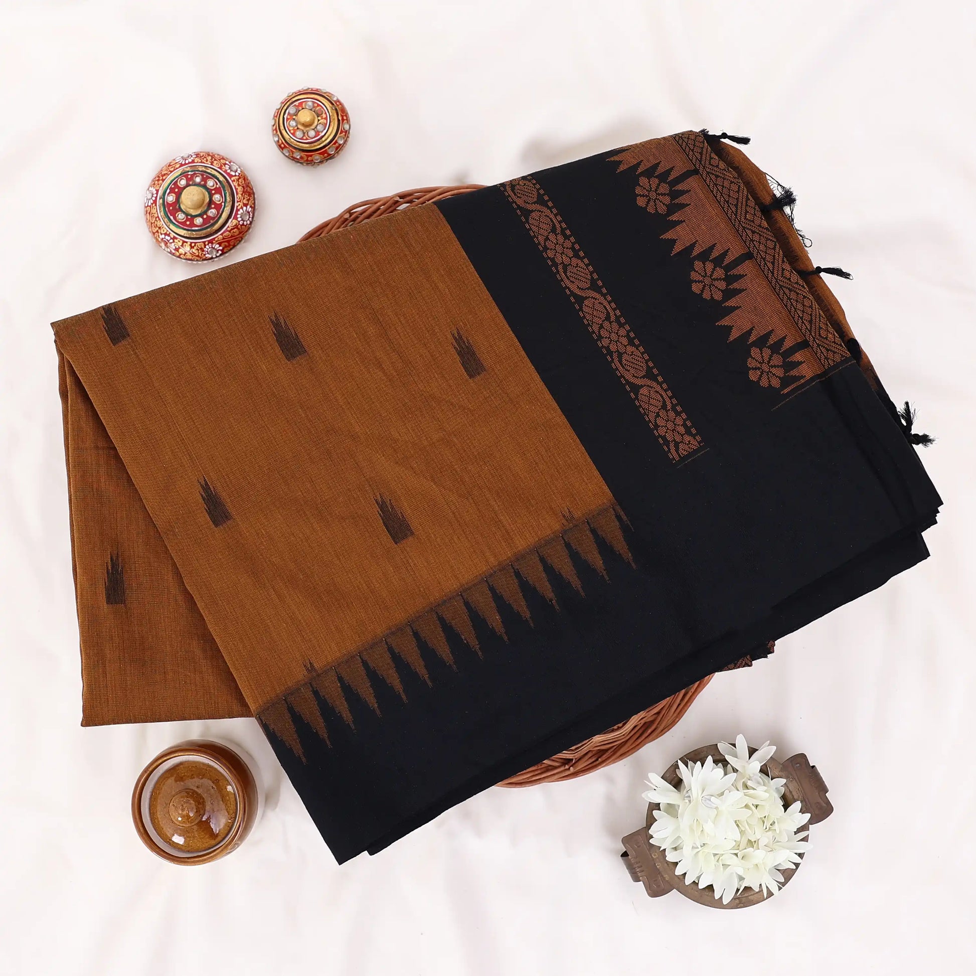 Kalyani Cotton saree with Brown body and black zari border, folded top view