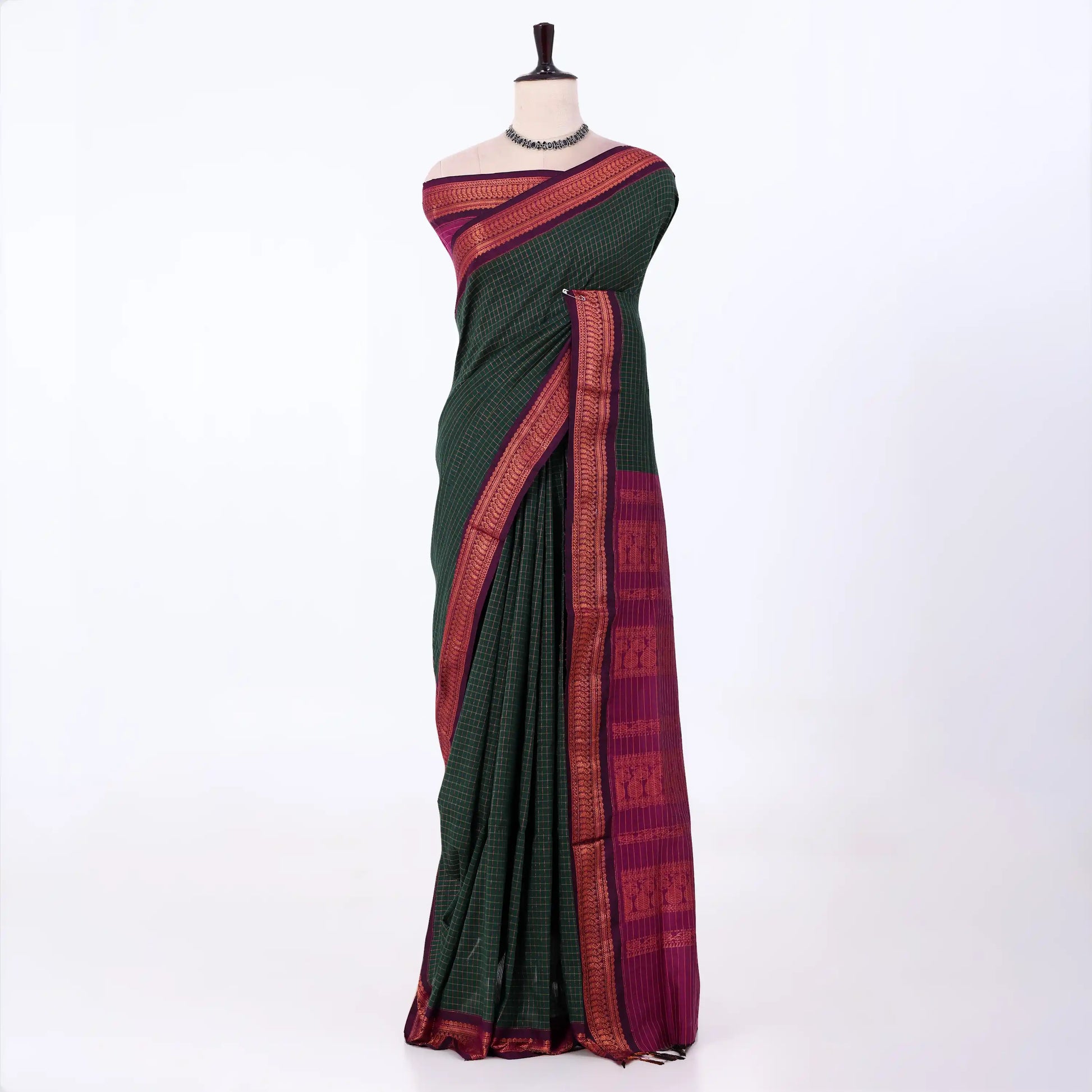Kalyani Cotton saree with dark green  checked body and purple zari woven border, front drape view