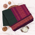 Kalyani Cotton saree with dark green  checked body and purple zari woven border, folded top view