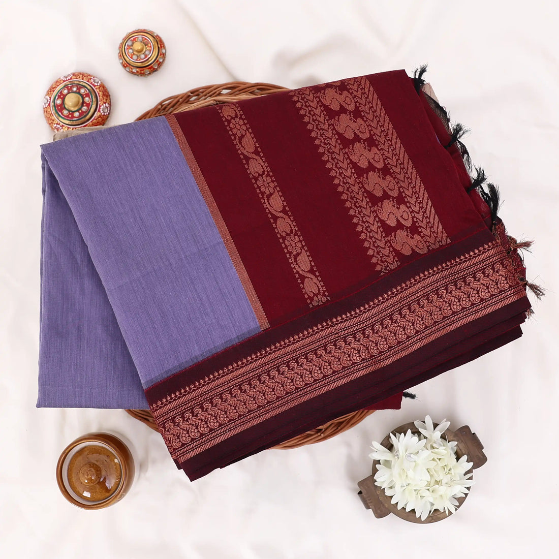 Kalyani Cotton saree with lavender body and maroon zari woven border, front drape view