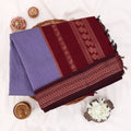 Kalyani Cotton saree with lavender body and maroon zari woven border, folded top view