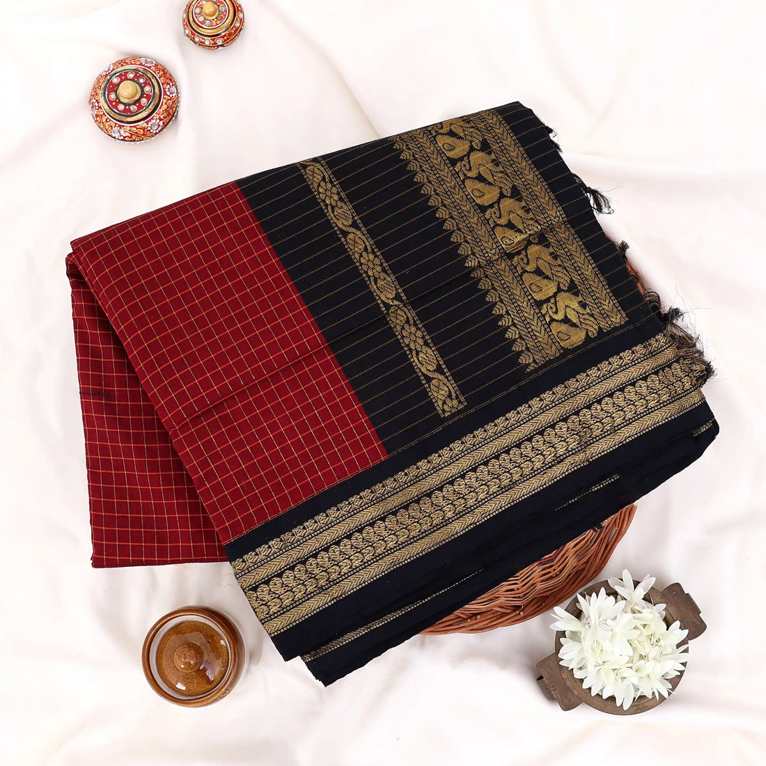 Kalyani Cotton saree with maroon checked body and black zari woven border, front drape view