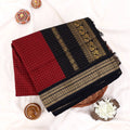 Kalyani Cotton saree with maroon checked body and black zari woven border, folded top view