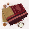 Kalyani Cotton saree with Olive green body and maroon zari border, folded top view