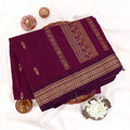 Kalyani Cotton saree with deep purple body and golden zari woven border, folded top view