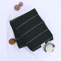 Khadi cotton saree with silver woven stripes green color and tassel detail folded flat lay product view.
