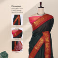 Green Sungudi cotton saree with gold zari checks and red peacock motif border draped front view on mannequin