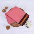 Sungudi cotton saree with zari checked body and contrast zari border in pink and maroon folded top view 
