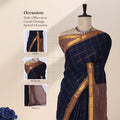Sungudi cotton saree with gold checkered weave and brown zari border in navy blue front draped view