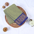Venkatagiri cotton saree with green checked body and blue zari border flat lay front view