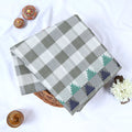 Grey and white checked Venkatagiri cotton saree with woven geometric border folded front view