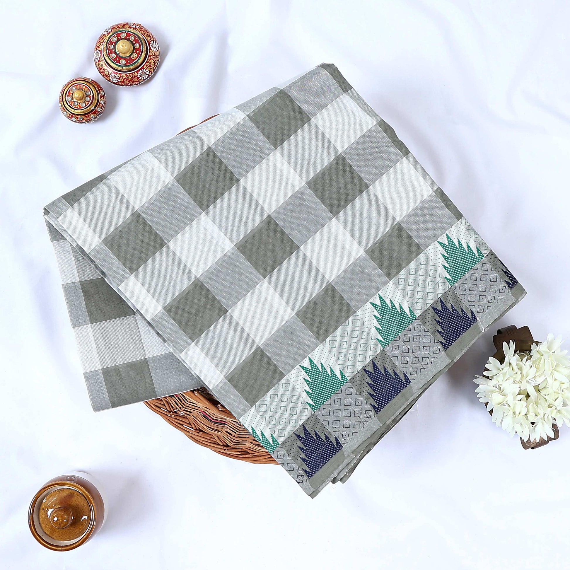 Grey and white checked Venkatagiri cotton saree with woven geometric border folded front view