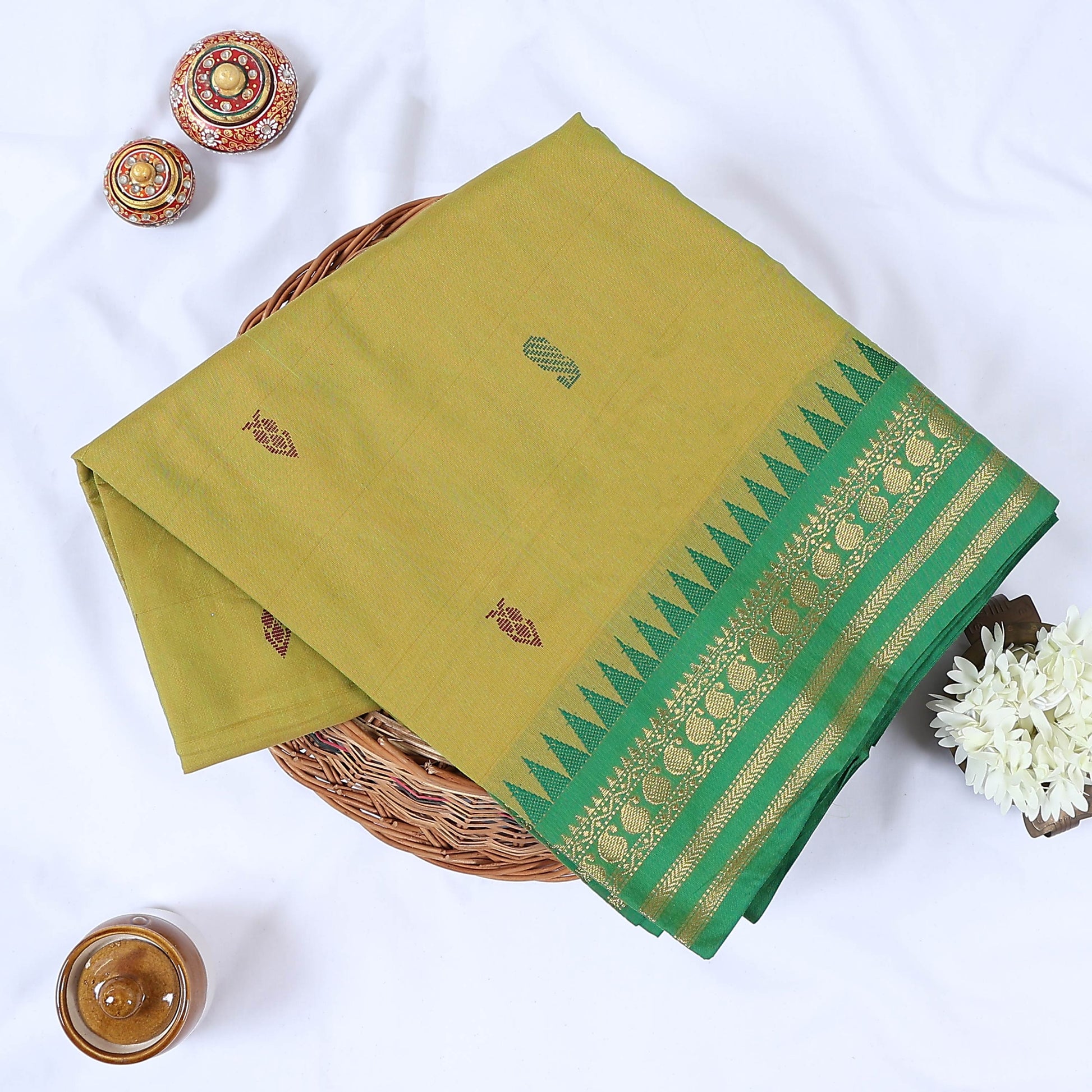 Venkatagiri cotton saree with light green body contrast green temple zari border and woven buttas folded front view
