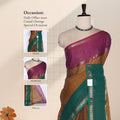 Front view of Venkatagiri cotton saree in magenta, brown and teal green with zari border draped on mannequin.
