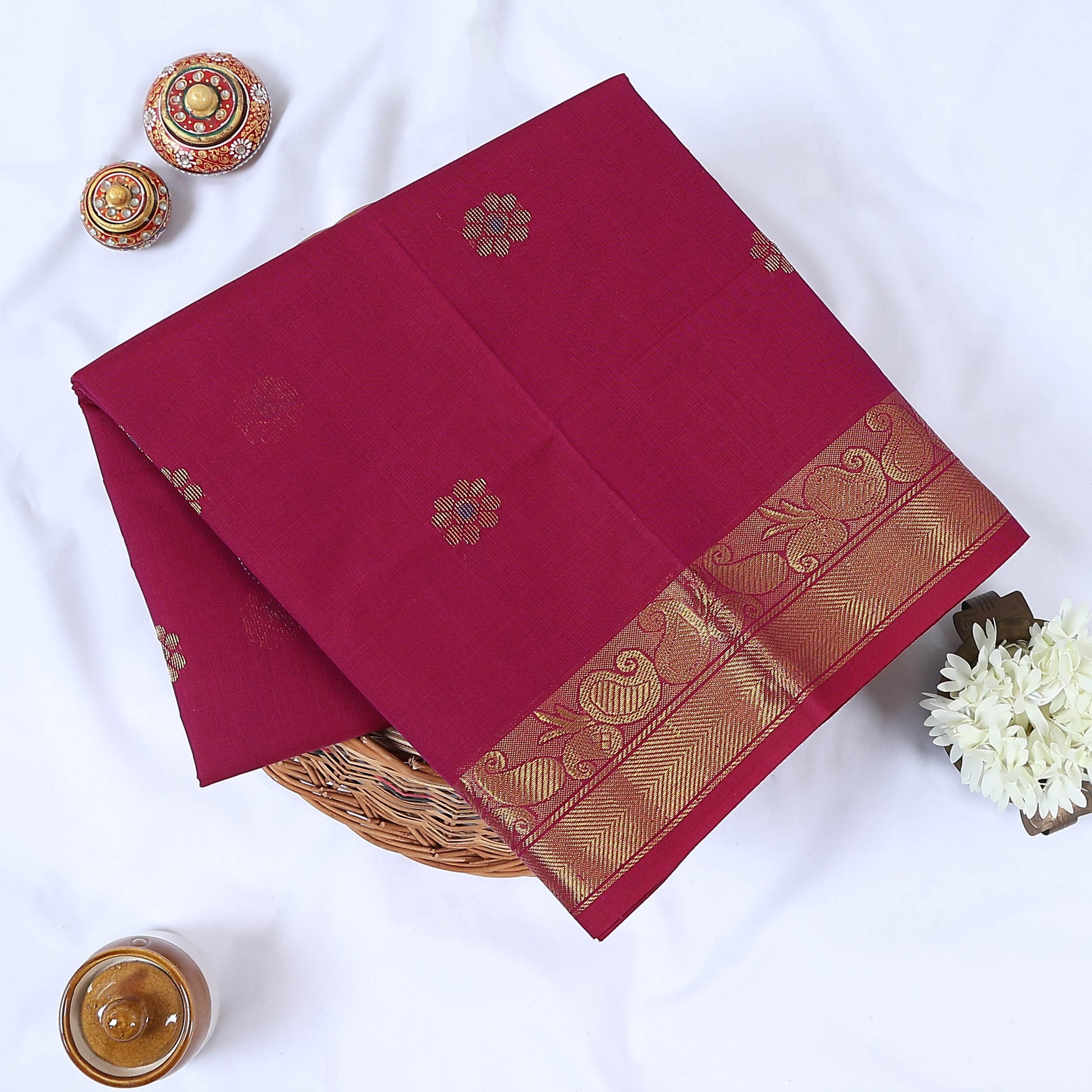 Venkatagiri cotton saree with elegant gold zari floral motifs and border in magenta pink front flat lay view