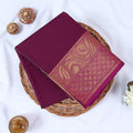 Folded Venkatagiri cotton saree in Purple a plain body and intricate gold zari floral border.