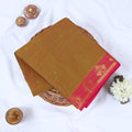 Venkatagiri cotton saree with plain olive green body floral zari pink border and butta motifs folded top view.