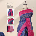 Voile cotton saree with tribal inspired print blue body and pink border front draped view on mannequin
