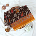 Brown Voile Cotton Saree with paisley floral print and contrast floral printed border folded top front view