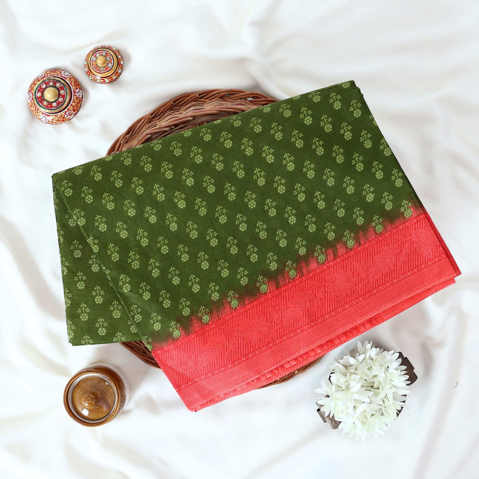 Green Voile Cotton Saree with Floral Butta Weave and Contrast Orange Zari Border Folded Top View