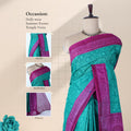 Green Voile cotton saree with spiral floral motifs and contrast border draped on mannequin front display view.