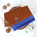 Brown Voile cotton saree with floral motifs butta body pattern and blue floral motif border folded top view