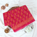 Pink Voile cotton saree with floral vine butta print and decorative border folded flat lay view
