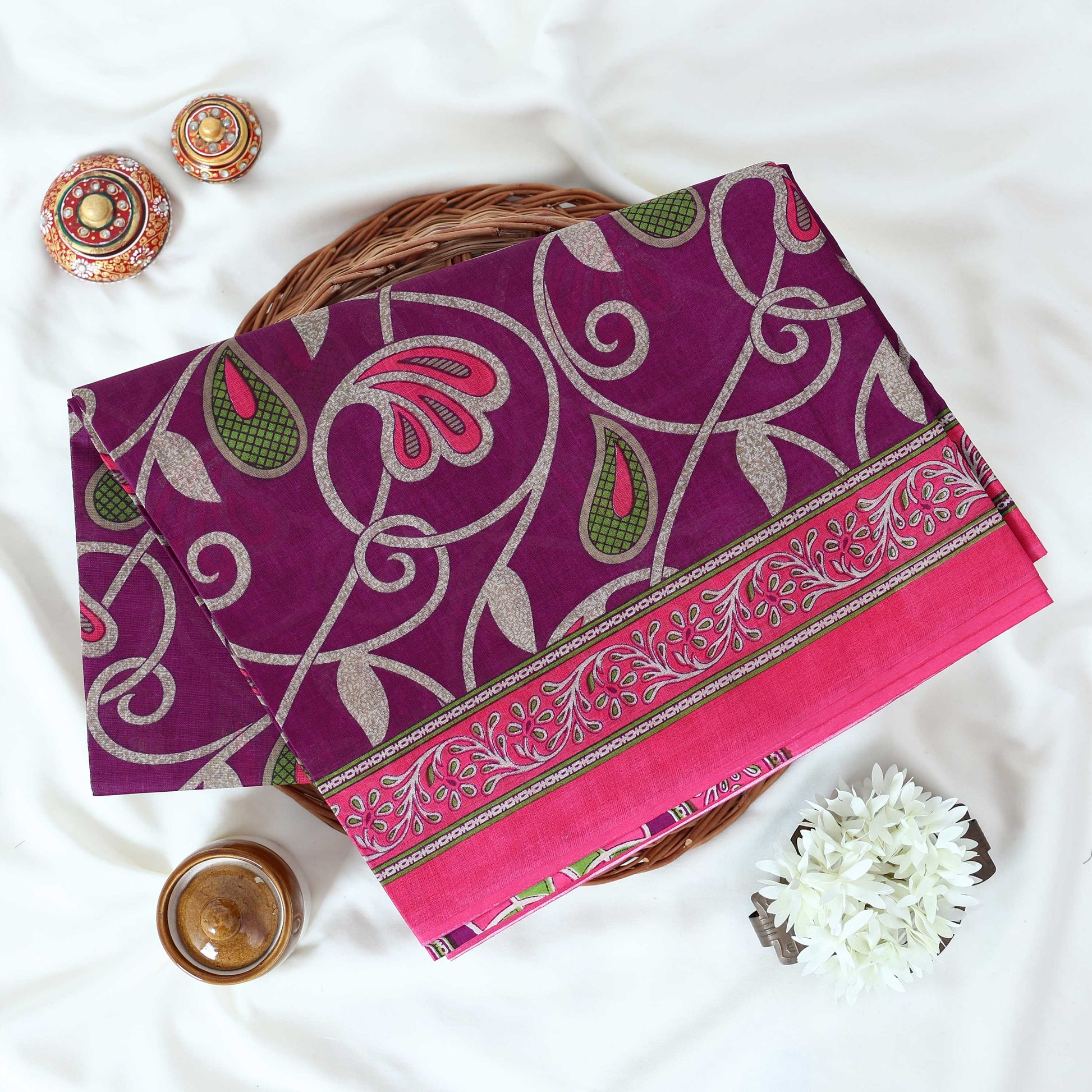 Purple Voile Cotton Saree with paisley floral print and contrast floral printed border folded top front view