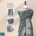 Green Dola silk saree with floral motif print and contrast woven border front view on mannequin with pallu.