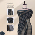 Front view of green Dola saree with geometric Bandhani print, zari woven border and decorative pallu on mannequin.