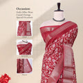 Front view of maroon Dola saree with floral print zari woven border and decorative pallu displayed on mannequin.